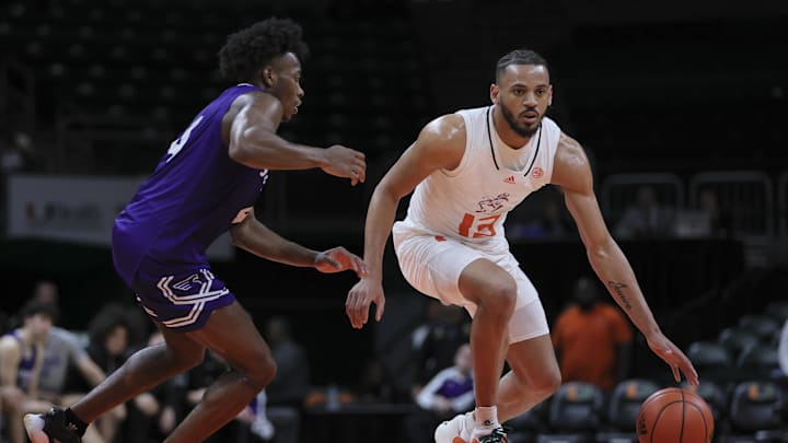 Dec 21, 2023; Coral Gables, Florida, USA; Miami Hurricanes guard Jakai Robinson (13) dribbles the