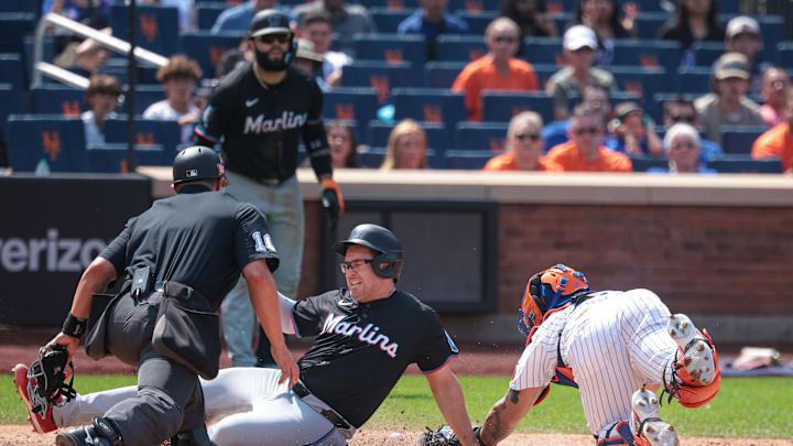 Aug 18, 2024; New York City, New York, USA; Miami Marlins first baseman Jonah Bride (41) scores a run as New York Mets catcher Francisco Alvarez (4) attempts a tag during the eighth inning at Citi Field. Mandatory Credit: Vincent Carchietta-USA TODAY Sports