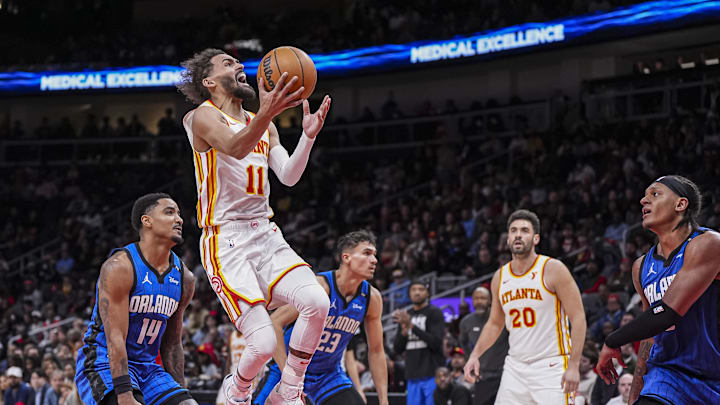 Feb 20, 2025; Atlanta, Georgia, USA; Atlanta Hawks guard Trae Young (11) goes to wards the basket behind Orlando Magic guard Gary Harris (14) during the second half at State Farm Arena. Mandatory Credit: Dale Zanine-Imagn Images Feb 20, 2025; Atlanta, Georgia, USA; Atlanta Hawks guard Trae Young (11) goes to wards the basket behind Orlando Magic guard Gary Harris (14) during the second half at State Farm Arena. Mandatory Credit: Dale Zanine-Imagn Images