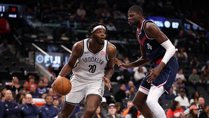 Jan 15, 2025; Inglewood, California, USA;  Brooklyn Nets center Day'Ron Sharpe (20) drives against LA Clippers center Mo Bamba (4) during the fourth quarter at Intuit Dome. Mandatory Credit: Kiyoshi Mio-Imagn Images