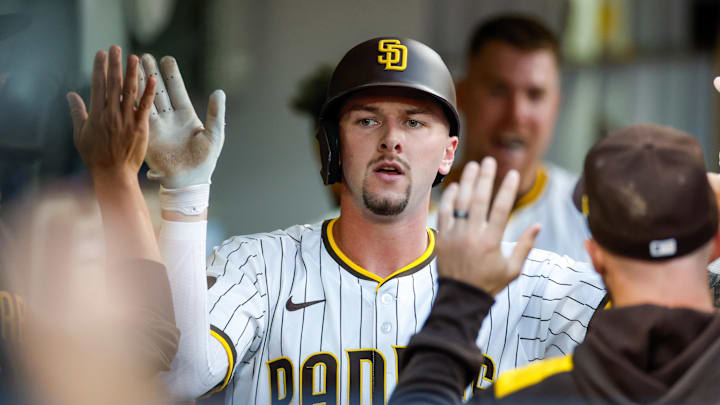 Sep 13, 2025; San Diego, California, USA; San Diego Padres center fielder Jackson Merrill (3) celebrates in the dugout after hitting a one run home run during the third inning against the Colorado Rockies at Petco Park. Mandatory Credit: David Frerker-Imagn Images