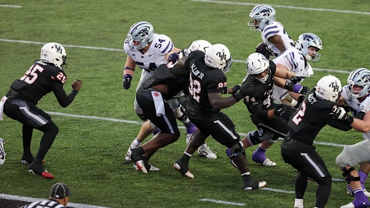 Nov 2, 2024; Houston, Texas, USA; Kansas State Wildcats running back DJ Giddens (31) rushes for a touchdown against the Houston Cougars n the second quarter at TDECU Stadium. Mandatory Credit: Thomas B. Shea-Imagn Images