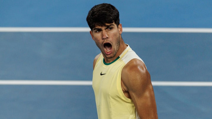 Jan 22, 2024; Melbourne, Victoria, Australia; Carlos Alcaraz of Spain celebrates his victory over Miomir Kecmanovic of Serbia in the fourth set.