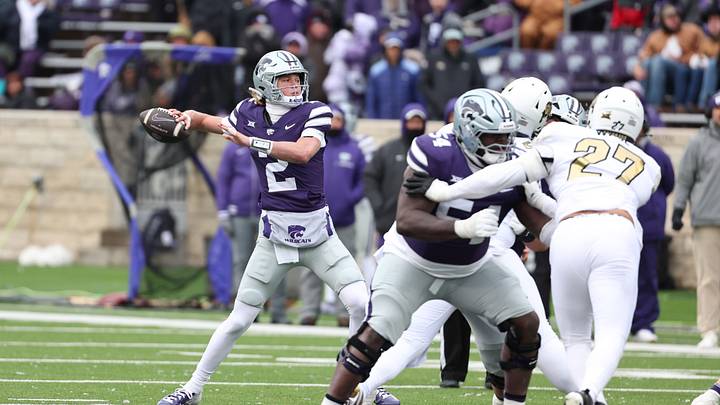 Nov 29, 2025; Manhattan, Kansas, USA; Kansas State Wildcats quarterback Avery Johnson (2) drops back to pass during the fourth quarter against the Colorado Buffaloes at Bill Snyder Family Football Stadium. Mandatory Credit: Scott Sewell-Imagn Images Nov 29, 2025; Manhattan, Kansas, USA; Kansas State Wildcats quarterback Avery Johnson (2) drops back to pass during the fourth quarter against the Colorado Buffaloes at Bill Snyder Family Football Stadium. Mandatory Credit: Scott Sewell-Imagn Images