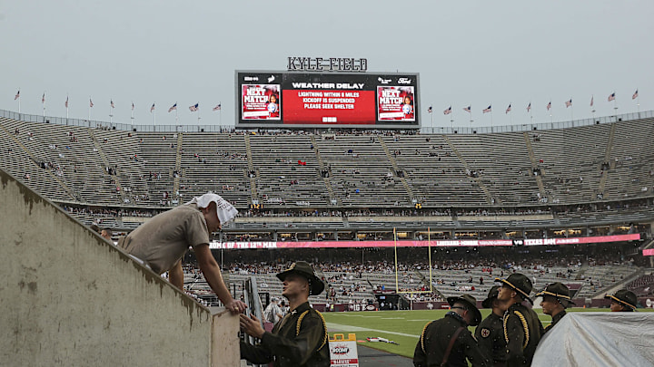 Sep 16, 2023; College Station, Texas, USA; A notice of weather delay is displayed on a video board at Kyle Field before the game between the Texas A&M Aggies and the Louisiana Monroe Warhawks. Mandatory Credit: Troy Taormina-Imagn Images