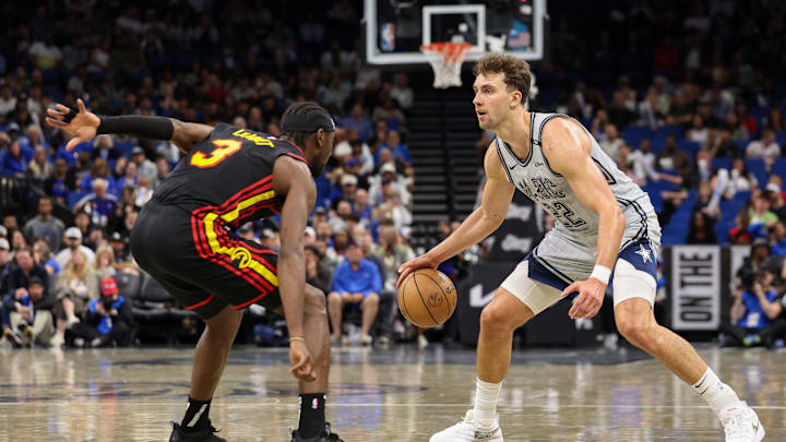 Feb 10, 2025; Orlando, Florida, USA; Orlando Magic forward Franz Wagner (22) is guarded by Atlanta Hawks guard Caris LeVert (3) in the fourth quarter at Kia Center. Mandatory Credit: Nathan Ray Seebeck-Imagn Images Feb 10, 2025; Orlando, Florida, USA; Orlando Magic forward Franz Wagner (22) is guarded by Atlanta Hawks guard Caris LeVert (3) in the fourth quarter at Kia Center. Mandatory Credit: Nathan Ray Seebeck-Imagn Images