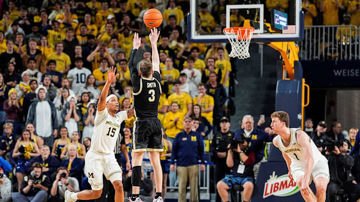 Purdue guard Braden Smith (3) shoots a three point basket against Michigan guard Rubin Jones (15)