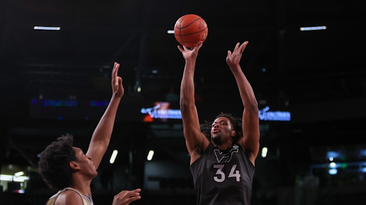 Jan 22, 2025; Atlanta, Georgia, USA; Virginia Tech Hokies forward Mylyjael Poteat (34) shoots against the Georgia Tech Yellow Jackets in the first half at McCamish Pavilion. Mandatory Credit: Brett Davis-Imagn Images