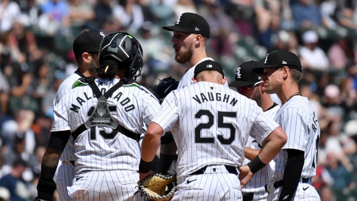 Apr 13, 2024; Chicago, Illinois, USA; Chicago White Sox starting pitcher Garrett Crochet (center) meets with teammates at the mound during the second inning against the Cincinnati Reds at Guaranteed Rate Field. Mandatory Credit: Patrick Gorski-USA TODAY Sports