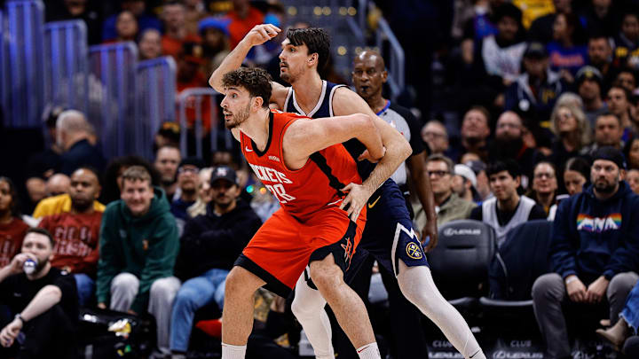 Jan 15, 2025; Denver, Colorado, USA; Houston Rockets center Alperen Sengun (28) and Denver Nuggets forward Dario Saric (9) battle for position in the third quarter at Ball Arena. Mandatory Credit: Isaiah J. Downing-Imagn Images