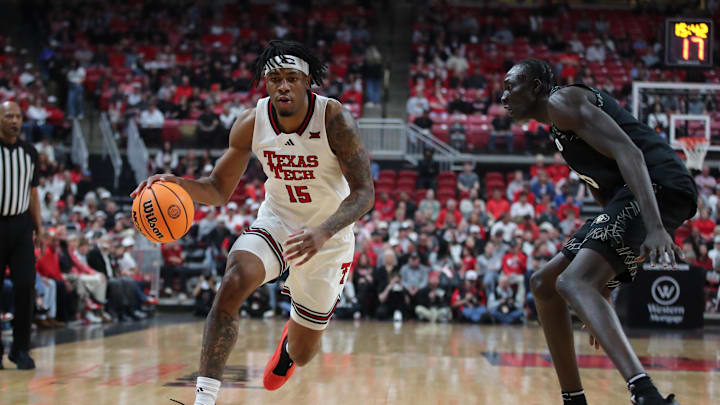 Feb 11, 2026; Lubbock, Texas, USA; Texas Tech Red Raiders forward JT Toppin (15) works the ball against Colorado Buffaloes forward Bangot Dak (8) in the first half at United Supermarkets Arena. Mandatory Credit: Michael C. Johnson-Imagn Images Feb 11, 2026; Lubbock, Texas, USA; Texas Tech Red Raiders forward JT Toppin (15) works the ball against Colorado Buffaloes forward Bangot Dak (8) in the first half at United Supermarkets Arena. Mandatory Credit: Michael C. Johnson-Imagn Images