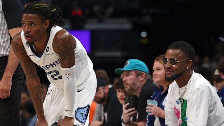 Oct 30, 2024; Memphis, Tennessee, USA; Memphis Grizzlies guard Ja Morant (12) waits for play to resume in front of his father, Tee Morant during the second half against the Brooklyn Nets at FedExForum. Mandatory Credit: Petre Thomas-Imagn Images