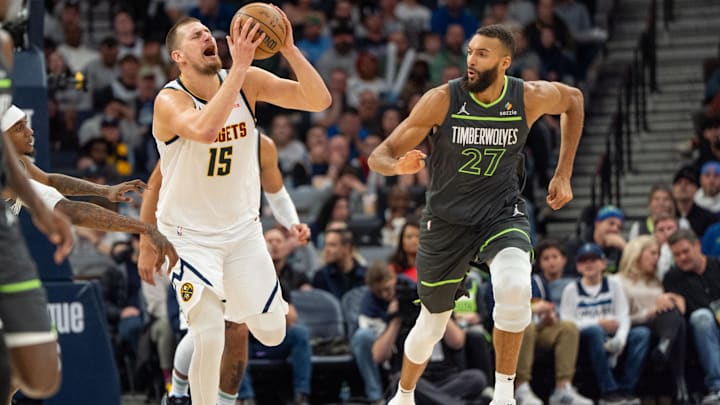Denver Nuggets center Nikola Jokic (15) tries to draw a foul on Minnesota Timberwolves forward Jaden McDaniels in the fourth quarter at Target Center in Minneapolis on Nov. 1, 2024.