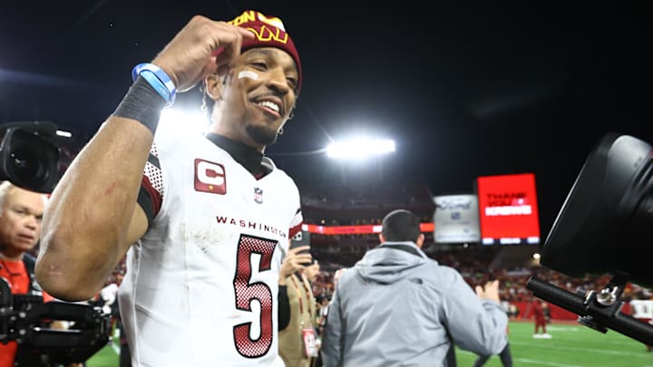 Jan 12, 2025; Tampa, Florida, USA; Washington Commanders quarterback Jayden Daniels (5) celebrates after winning a NFC wild card playoff against the Tampa Bay Buccaneers at Raymond James Stadium. Mandatory Credit: Kim Klement Neitzel-Imagn Images
