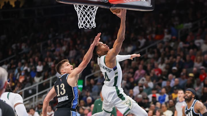 Mar 30, 2024; Atlanta, Georgia, USA; Milwaukee Bucks forward Giannis Antetokounmpo (34) shoots past