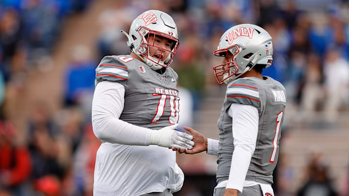 UNLV Rebels quarterback Jayden Maiava (1) celebrates his touchdown pass with offensive lineman Tiger Shanks (70) in the first quarter against the Air Force Falcons at Falcon Stadium. 