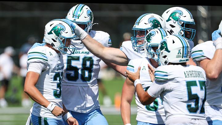 Sep 19, 2026; Manhattan, Kansas, USA; Tulane Green Wave kicker Cooper Helmke (35) is congratulated by teammates after kicking a 58-yard field goal in the first quarter against the Kansas State Wildcats at Bill Snyder Family Football Stadium. Mandatory Credit: Scott Sewell-Imagn Images Sep 19, 2026; Manhattan, Kansas, USA; Tulane Green Wave kicker Cooper Helmke (35) is congratulated by teammates after kicking a 58-yard field goal in the first quarter against the Kansas State Wildcats at Bill Snyder Family Football Stadium. Mandatory Credit: Scott Sewell-Imagn Images