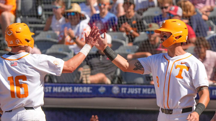May 21, 2025; Hoover, AL, USA; Tennessee centerfielder Hunter Ensley (9) congratulates Tennessee left fielder Dalton Bargo (16) after Bargo scored during a five-run outburst in the sixth inning in the second round of the SEC Baseball Tournament at the Hoover Met.