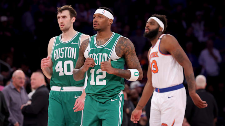 May 16, 2025; New York, New York, USA; Boston Celtics forward Torrey Craig (12) and center Luke Kornet (40) react in front of New York Knicks center Mitchell Robinson (23) during the fourth quarter of game six in the second round of the 2025 NBA Playoffs at Madison Square Garden.