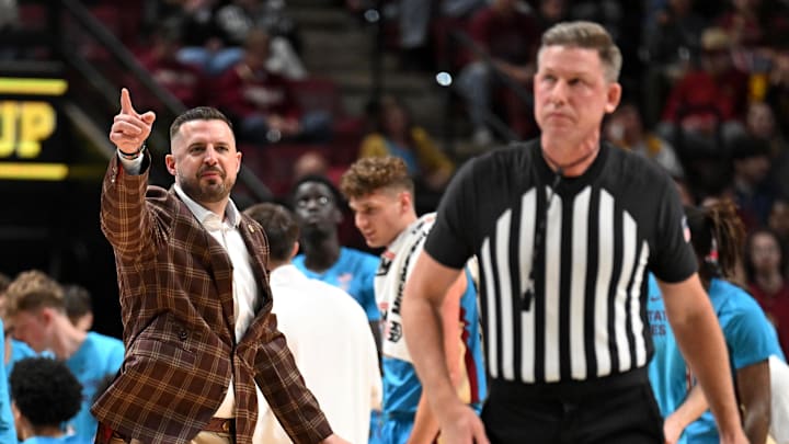 Feb 24, 2026; Tallahassee, Florida, USA; Florida State Seminoles head coach Luke Loucks exchanges words with a referee during the first half against the Miami Hurricanes at Donald L. Tucker Center. Mandatory Credit: Melina Myers-Imagn Images