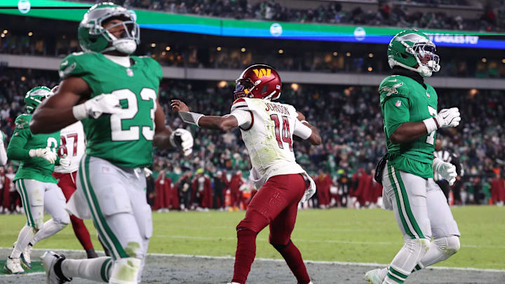 Jan 4, 2026; Philadelphia, Pennsylvania, USA; Washington Commanders quarterback Josh Johnson (14) reacts to his touchdown run against the Philadelphia Eagles during the fourth quarter at Lincoln Financial Field. Mandatory Credit: Bill Streicher-Imagn Images