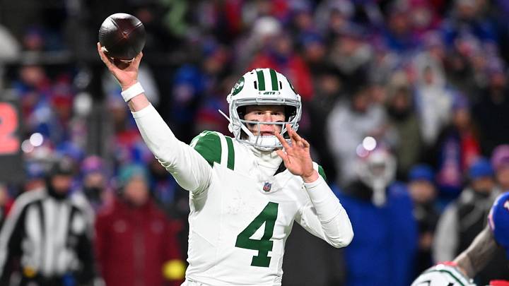 New York Jets quarterback Brady Cook (4) passes the ball against the Buffalo Bills during the third quarter at Highmark Stadium.