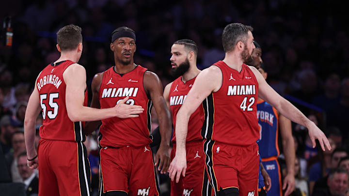 Miami Heat forward Jimmy Butler reacts with teammates.
