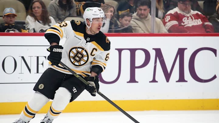 Mar 1, 2025; Pittsburgh, Pennsylvania, USA;  Boston Bruins left wing Brad Marchand (63) skates with the puck against the Pittsburgh Penguins during the first period at PPG Paints Arena. Mandatory Credit: Charles LeClaire-Imagn Images