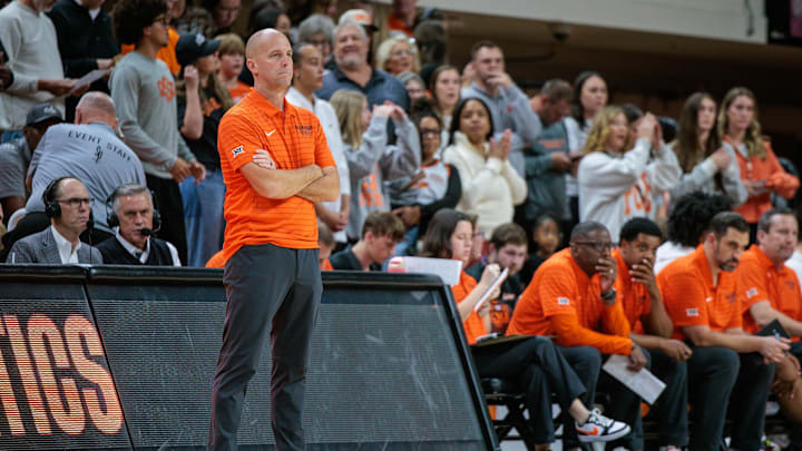 Nov 4, 2025; Stillwater, Oklahoma, USA; Oklahoma State Cowboys coach Steve Lutz watches game play during the first half against the Oral Roberts Golden Eagles at Gallagher-Iba Arena. Mandatory Credit: William Purnell-Imagn Images