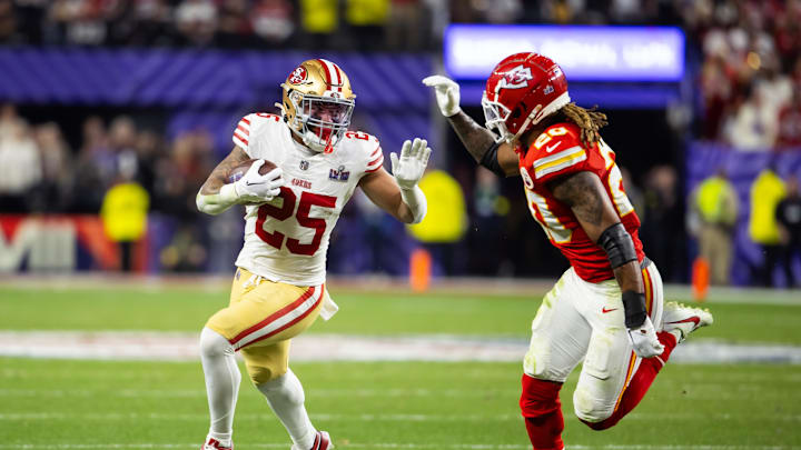 Feb 11, 2024; Paradise, Nevada, USA; San Francisco 49ers running back Elijah Mitchell (25) against Kansas City Chiefs safety Justin Reid (20) in Super Bowl LVIII at Allegiant Stadium. Mandatory Credit: Mark J. Rebilas-Imagn Images