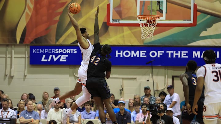 Nov 27, 2024; Lahaina, Hawaii, USA;  Auburn Tigers center Dylan Cardwell (44) attempts a shot over Memphis Tigers forward Dain Dainja (42) in the second half in Lahaina Civic Center. Mandatory Credit: Marco Garcia-Imagn Images