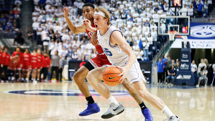 BYU's Richie Saunders drives the ball against Chance McMillian
