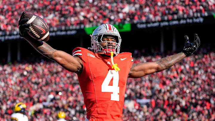 Ohio State wide receiver Jeremiah Smith (4) celebrates a touchdown against Michigan during the first half at Ohio Stadium in Columbus, Ohio on Saturday, Nov. 30, 2024.