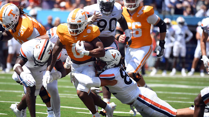 Sep 2, 2023; Nashville, Tennessee, USA; Tennessee Volunteers running back Jaylen Wright (0) runs for a short gain during the first half against the Virginia Cavaliers at Nissan Stadium. Mandatory Credit: Christopher Hanewinckel-USA TODAY Sports