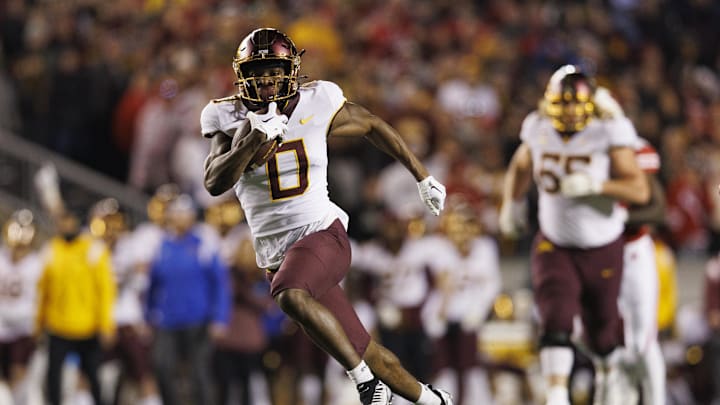Nov 26, 2022; Madison, Wisconsin, USA;  Minnesota Golden Gophers wide receiver Le'Meke Brockington (0) rushes for a touchdown after catching a pass during the fourth quarter against the Wisconsin Badgers at Camp Randall Stadium. Mandatory Credit: Jeff Hanisch-Imagn Images