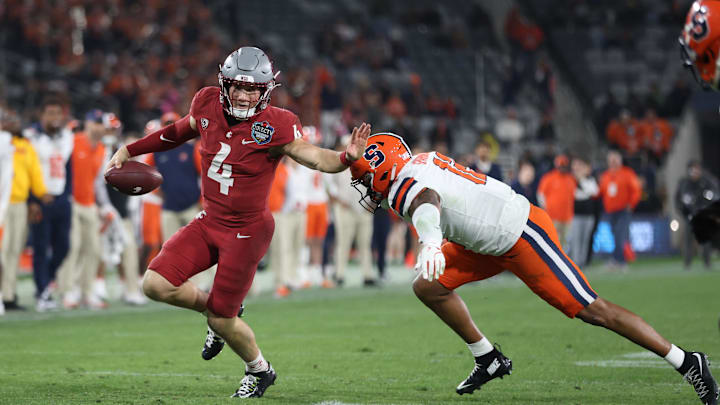 Dec 27, 2024; San Diego, CA, USA; Washington State Cougars quarterback Zevi Eckhaus (4) runs the ball against Syracuse Orange defense during the second half at Snapdragon Stadium. Mandatory Credit: Abe Arredondo-Imagn Images