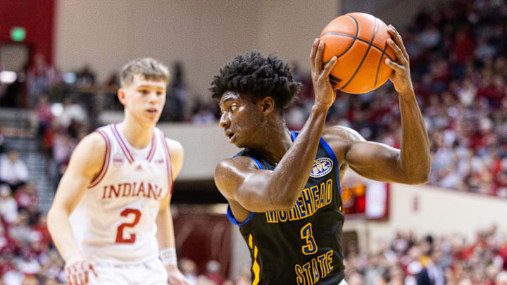 Dec 19, 2023; Bloomington, Indiana, USA; Morehead State Eagles guard Drew Thelwell (3) catches the ball while Indiana Hoosiers guard Gabe Cupps (2) defends in the first half at Simon Skjodt Assembly Hall. Mandatory Credit: Trevor Ruszkowski-USA TODAY Sports