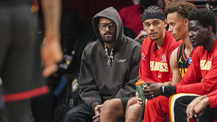 Dec 31, 2025; Atlanta, Georgia, USA; Atlanta Hawks injured player Trae Young (center in hoodie) on the bench during the game against the Minnesota Timberwolves during the second half at State Farm Arena. Mandatory Credit: Dale Zanine-Imagn Images