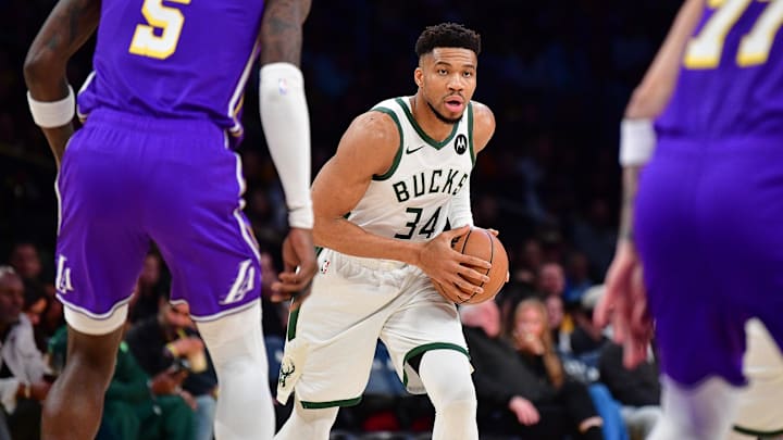 Jan 9, 2026; Los Angeles, California, USA; Milwaukee Bucks forward Giannis Antetokounmpo (34) controls the ball against the Los Angeles Lakers during the first half at Crypto.com Arena. Mandatory Credit: Gary A. Vasquez-Imagn Images