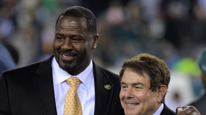 Eagles former linebacker Jeremiah Trotter (left) and Eagles play-by-play announcer Merrill Reese.