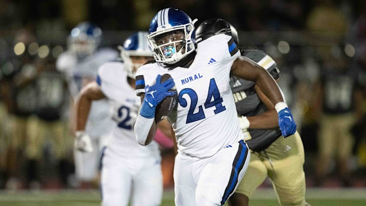 Washburn Rural junior TJ Minikwu (24) takes off on a play in the first quarter of the game against Topeka High at Hummer Sports Park on Friday, October 4, 2024.