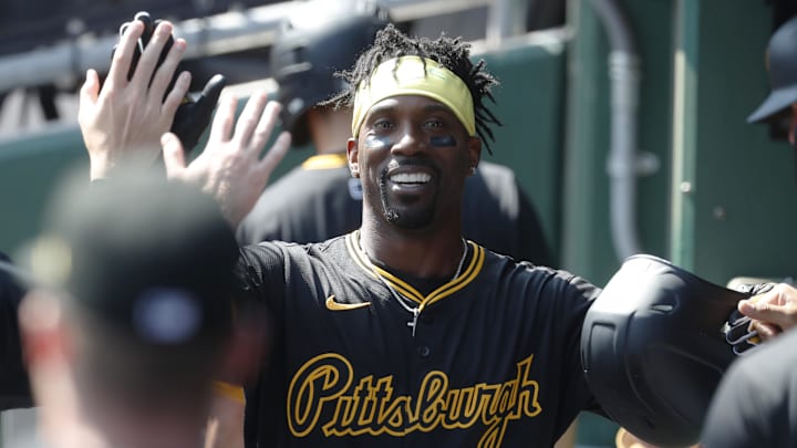 Sep 8, 2024; Pittsburgh, Pennsylvania, USA;  Pittsburgh Pirates designated hitter Andrew McCutchen (22) celebrates in the dugout after hitting a solo home run against the Washington Nationals during the third inning at PNC Park. Mandatory Credit: Charles LeClaire-Imagn Images