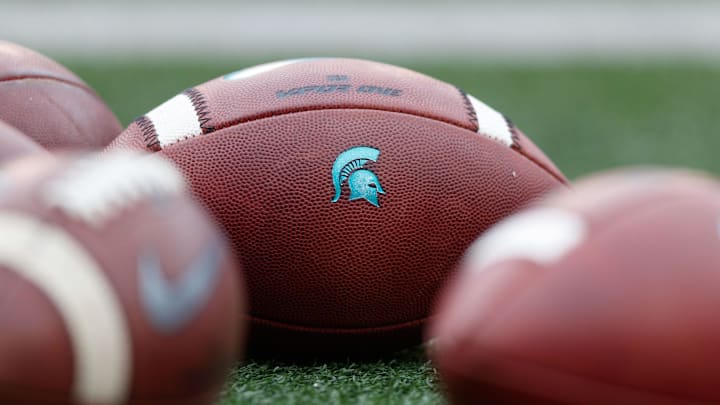Oct 12, 2019; Madison, WI, USA; Michigan State Spartans logo on footballs during warmups prior to