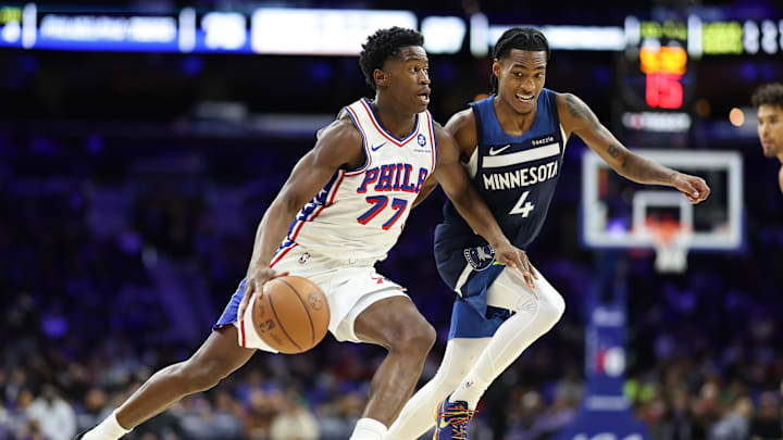 Oct 17, 2025; Philadelphia, PA; Philadelphia 76ers rookie VJ Edgecombe drives past Minnesota Timberwolves guard Rob Dillingham