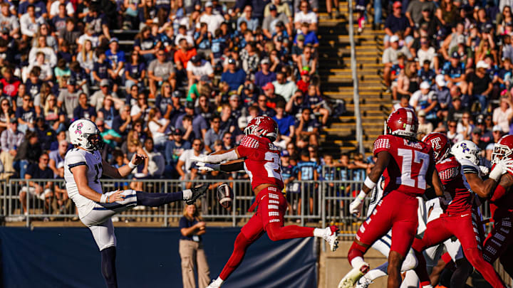 Oct 5, 2024; East Hartford, Connecticut, USA; Temple Owls linebacker Antwone Santiago (23) blocks the punt for a recovered touchdown against the Connecticut Huskies in the second quarter at Rentschler Field at Pratt & Whitney Stadium. Mandatory Credit: David Butler II-Imagn Images