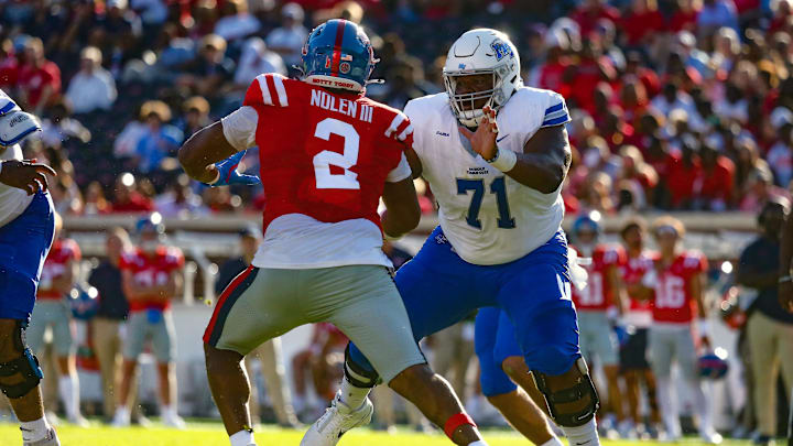 Sep 7, 2024; Oxford, Mississippi, USA; Middle Tennessee Blue Raiders offensive linemen Ellis Adams (71) blocks Mississippi Rebels defensive linemen Walter Nolen (2) during the second half at Vaught-Hemingway Stadium. Mandatory Credit: Petre Thomas-Imagn Images