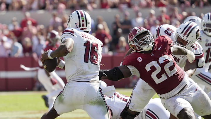 Oct 12, 2024; Tuscaloosa, Alabama, USA; South Carolina Gamecocks quarterback LaNorris Sellers (16) evades a rush by Alabama Crimson Tide defensive lineman LT Overton (22) at Bryant-Denny Stadium. Alabama defeated South Carolina 27-25. Mandatory Credit: Gary Cosby Jr.-Imagn Images Oct 12, 2024; Tuscaloosa, Alabama, USA; South Carolina Gamecocks quarterback LaNorris Sellers (16) evades a rush by Alabama Crimson Tide defensive lineman LT Overton (22) at Bryant-Denny Stadium. Alabama defeated South Carolina 27-25. Mandatory Credit: Gary Cosby Jr.-Imagn Images