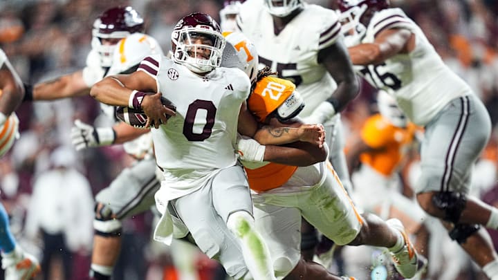 Nov 9, 2024; Knoxville, Tennessee, USA; Mississippi State Bulldogs quarterback Michael Van Buren Jr. (0) is taken down by Tennessee Volunteers defensive lineman Bryson Eason (20) during the second half at Neyland Stadium. Mandatory Credit: Caitie McMekin/USA TODAY Network via Imagn Images