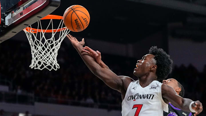 Cincinnati Bearcats guard Keyshuan Tillery (7) is fouled by Western Carolina Catamounts forward Chase McKey (1) on his way to the basket in the first half of the NCAA men’s basketball game between the Cincinnati Bearcats and the Western Carolina Catamounts at Fifth Third Arena in Cincinnati on Monday, Nov. 3, 2025. Cincinnati Bearcats guard Keyshuan Tillery (7) is fouled by Western Carolina Catamounts forward Chase McKey (1) on his way to the basket in the first half of the NCAA men’s basketball game between the Cincinnati Bearcats and the Western Carolina Catamounts at Fifth Third Arena in Cincinnati on Monday, Nov. 3, 2025.
