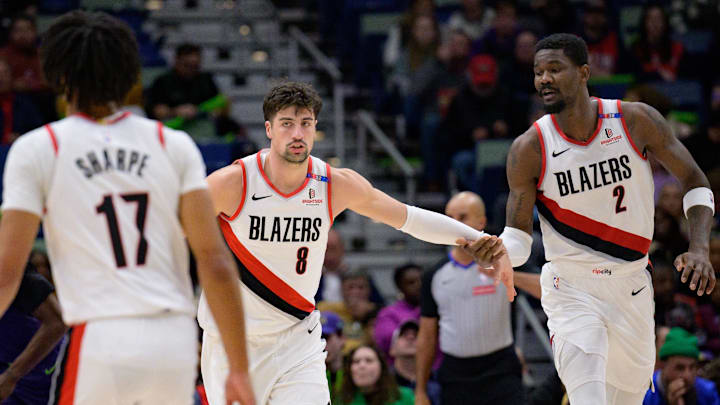 Jan 8, 2025; New Orleans, Louisiana, USA; Portland Trail Blazers forward Deni Avdija (8) celebrates with center Deandre Ayton (2) next to guard Shaedon Sharpe (17) during the first half against the New Orleans Pelicans at Smoothie King Center. Mandatory Credit: Matthew Hinton-Imagn Images
